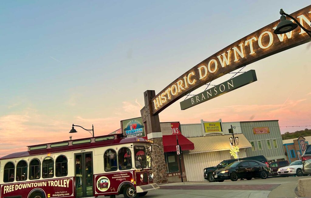 The RideSparky free trolley travels under the new Historic Downtown arch on Main Street.