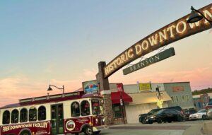 The RideSparky free trolley travels under the new Historic Downtown arch on Main Street.